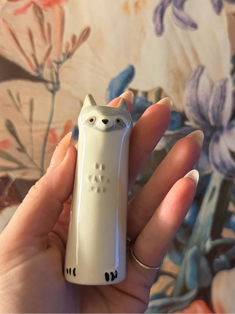 Hand-sculpted raccoon bud vase from an Etsy artist in like new condition :)